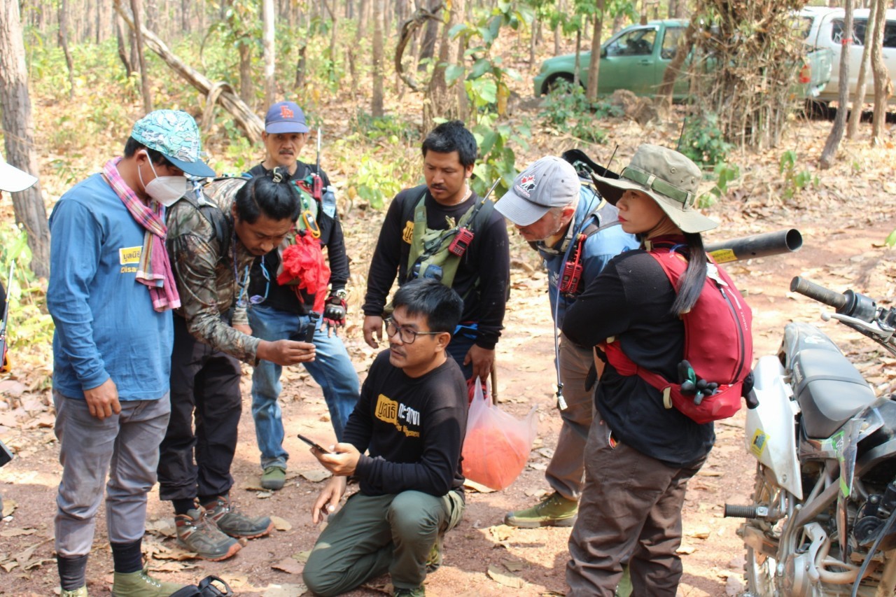 Firefighting team looking at drone survey